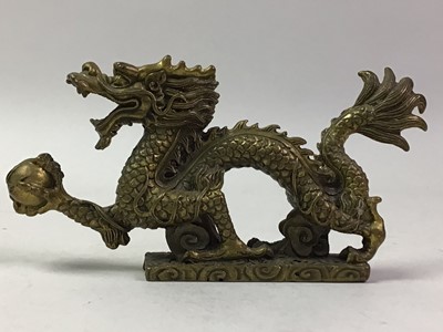 Lot 699 - CHINESE BRONZE MODEL OF A DRAGON HOLDING A PEARL