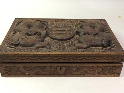 Lot 860 - CHINESE CARVED WOOD CASKET