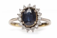 Lot 200 - SAPPHIRE AND DIAMOND CLUSTER RING the oval...