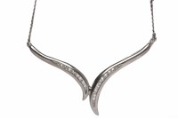 Lot 209 - NINE CARAT WHITE GOLD DIAMOND NECKLET with two...