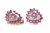 Lot 215 - RUBY AND DIAMOND STUD EARRINGS of heart form,...
