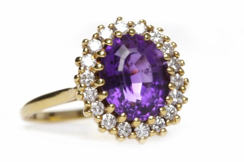 Lot 222 - AMETHYST AND DIAMOND CLUSTER RING the central...