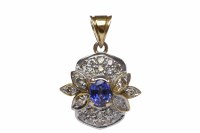 Lot 250 - BLUE GEM AND DIAMOND PENDANT the central oval...