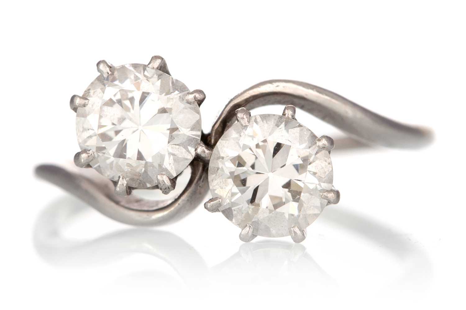 Lot 411 - DIAMOND TWO STONE CROSSOVER RING