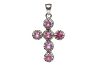 Lot 314 - WHITE GOLD RUBY CROSS PENDANT set with round...