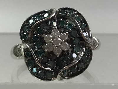 Lot 601 - FOUR TREATED BLUE DIAMOND RINGS