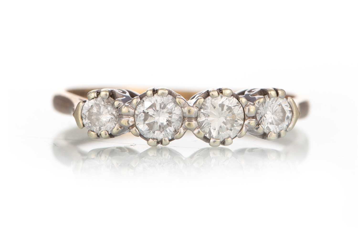 Lot 569 - DIAMOND FOUR STONE RING