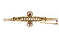 Lot 462 - EDWARDIAN NINE CARAT GOLD RUBY AND SEED PEARL...