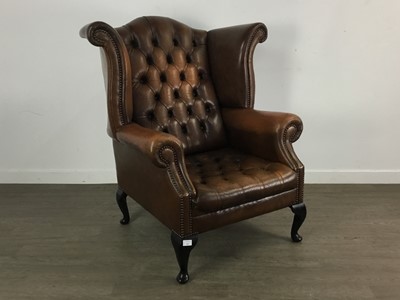 Lot 611 - DARK TAN LEATHER  WINGBACK ARMCHAIR