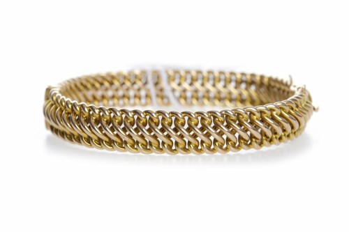 Lot 482 - YELLOW GOLD BANGLE of woven form, the metal...