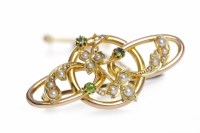 Lot 486 - SPLIT SEED PEARL BROOCH with round green gems...