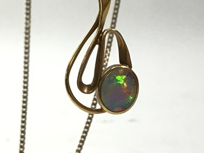 Lot 464 - THREE PENDANTS ON CHAINS