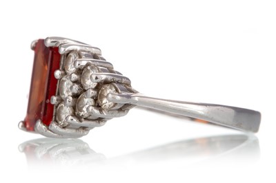 Lot 548 - ORANGE SAPPHIRE AND DIAMOND RING