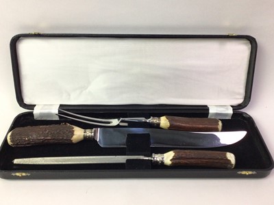 Lot 673 - HORN HANDLED THREE PIECE CARVING SET