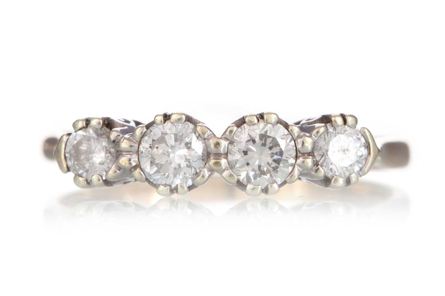 Lot 405 - DIAMOND FOUR STONE RING