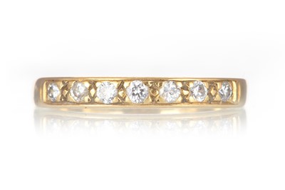 Lot 602 - GOLD DIAMOND SEVEN STONE RING