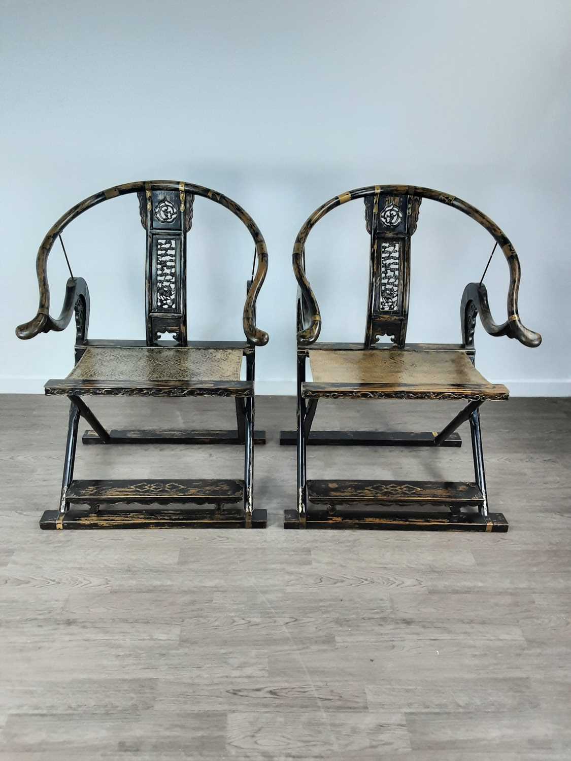 Lot 1255 - PAIR OF CHINESE HARDWOOD MING-STYLE FOLDING HORSESHOE-BACK CHAIRS