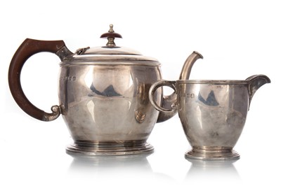 Lot 1327 - GEORGE V SILVER TEAPOT AND CREAM JUG