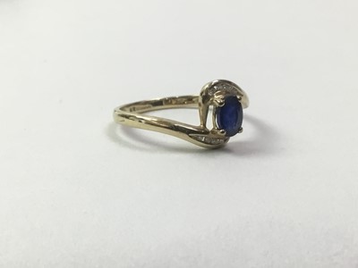 Lot 305 - NINE CARAT GOLD DIAMOND AND SAPHIRE RING