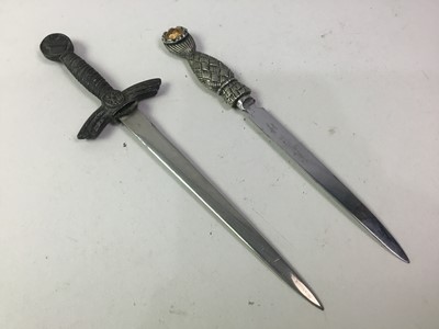 Lot 565 - TWO NOVELTY PAPERKNIVES