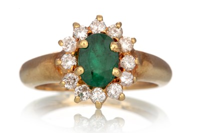 Lot 557 - EMERALD AND DIAMOND CLUSTER RING