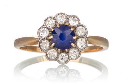 Lot 654 - SYNTHETIC SAPPHIRE AND DIAMOND CLUSTER RING