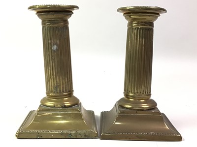 Lot 820 - TWO PAIRS OF BRASS CANDLESTICKS