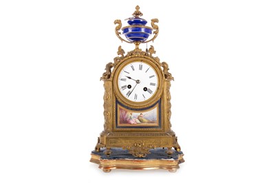 Lot 1004 - FRENCH GILT BRASS AND PORCELAIN MANTEL CLOCK.