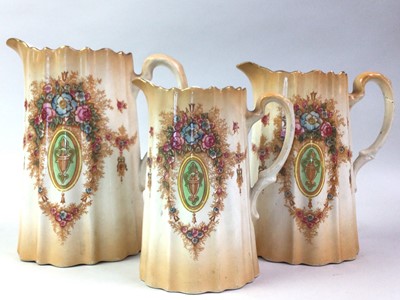 Lot 299 - SET OF THREE GRADUATED DEVON WARE JUGS