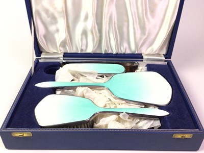 Lot 714 - WHITE METAL AND GUILLOCHE ENAMEL FOUR-PIECE DRESSING TABLE SET