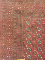 Lot 360 - AFGHAN BOKHARA RUG decorated with rows of...