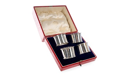 Lot 832 - SET OF FOUR EDWARDIAN SILVER NAPKIN RINGS