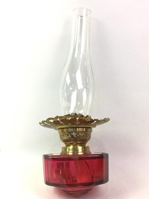 Lot 46 - VICTORIAN BRASS AND CRANBERRY GLASS OIL LAMP