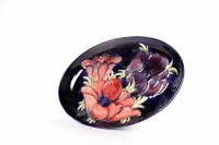 Lot 520 - MOORCROFT OVAL TRAY decorated with tube-lined...