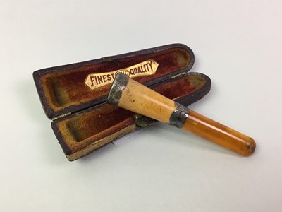Lot 55 - SILVER AND AMBER CIGARETTE HOLDER