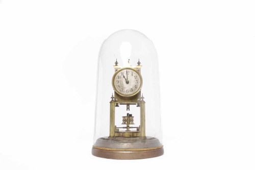 Lot 611 - BRASS ANNIVERSARY CLOCK the silvered dial with...