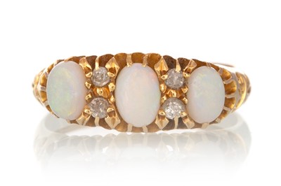 Lot 569 - OPAL AND DIAMOND RING