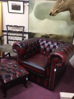 Lot 810 - OXBLOOD ARMCHAIR IN THE CHESTERFIELD MANNER...