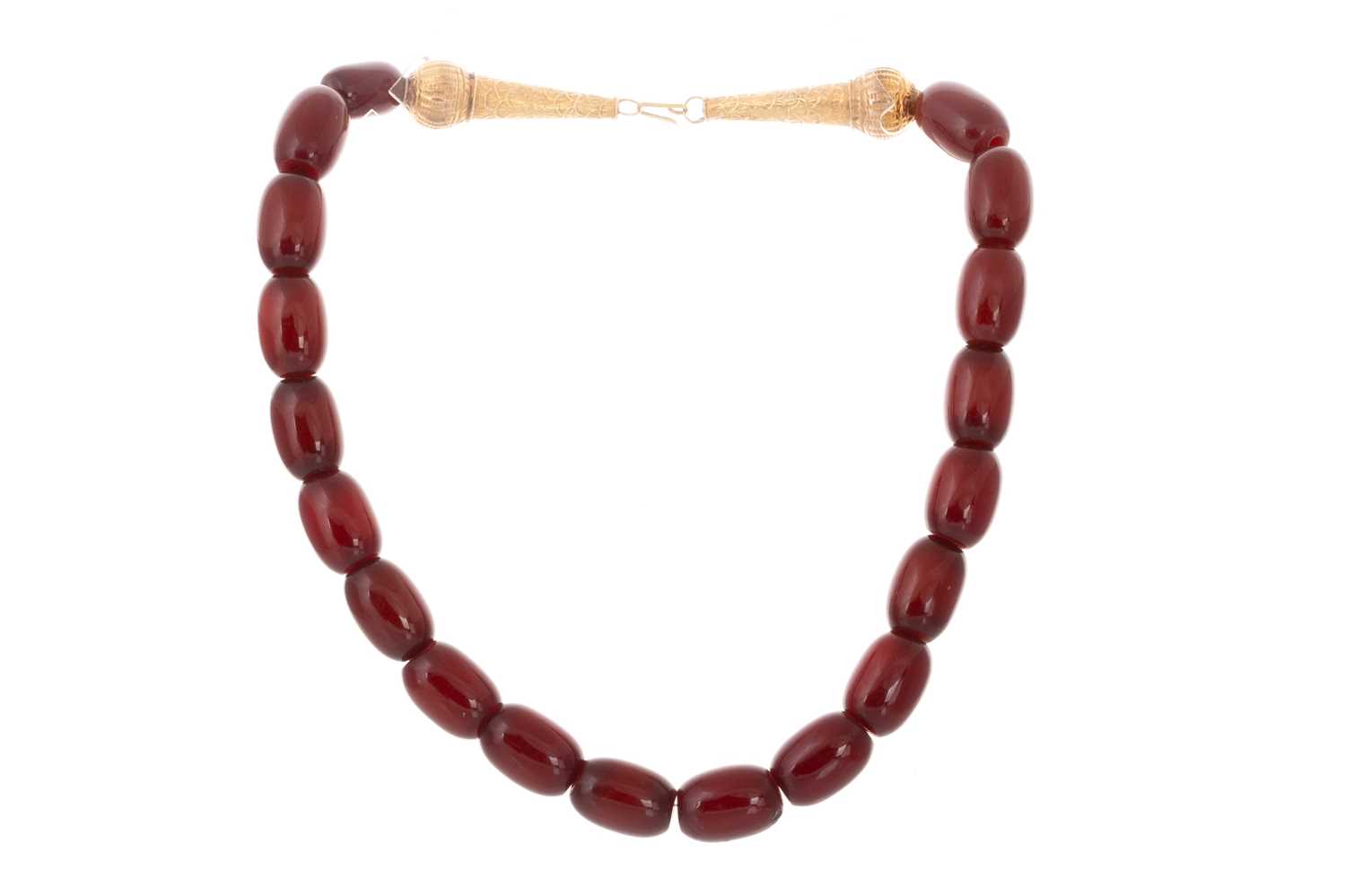 Lot 409 - EGG YOLK AMBER BEAD NECKLACE