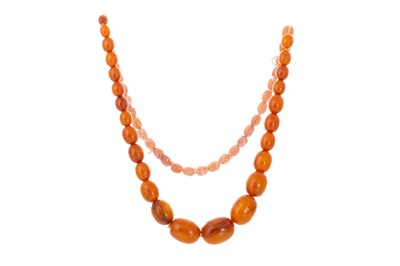 Lot 409 - EGG YOLK AMBER BEAD NECKLACE