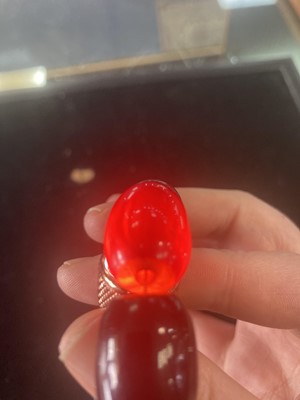 Lot 409 - EGG YOLK AMBER BEAD NECKLACE