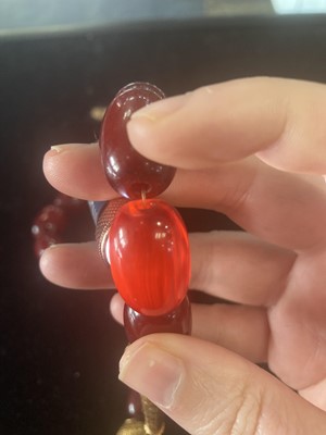 Lot 409 - EGG YOLK AMBER BEAD NECKLACE