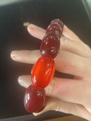 Lot 409 - EGG YOLK AMBER BEAD NECKLACE