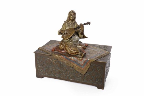Lot 857 - COLD CAST BRONZE and BRASS OBLONG MUSICAL...