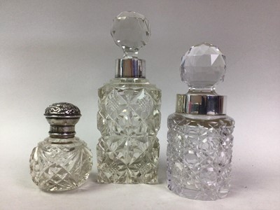 Lot 158 - THREE SILVER MOUNTED CRYSTAL PERFUME BOTTLES