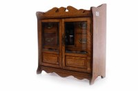 Lot 866 - LATE VICTORIAN SMOKER'S OAK CABINET with a...
