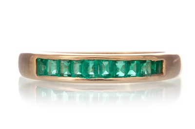 Lot 630 - EMERALD HALF ETERNITY RING