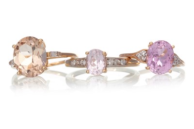 Lot 684 - THREE PINK GEM SET RINGS