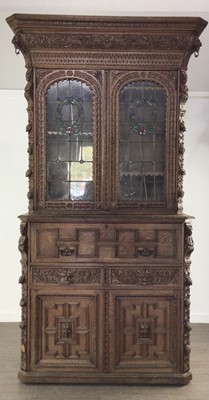 Lot 176 - VICTORIAN CARVED OAK BOOKCASE ON SECRETAIRE CHEST