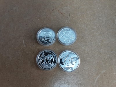 Lot 643 - FOUR CHINA FINE SILVER PANDA 10 YUAN COINS